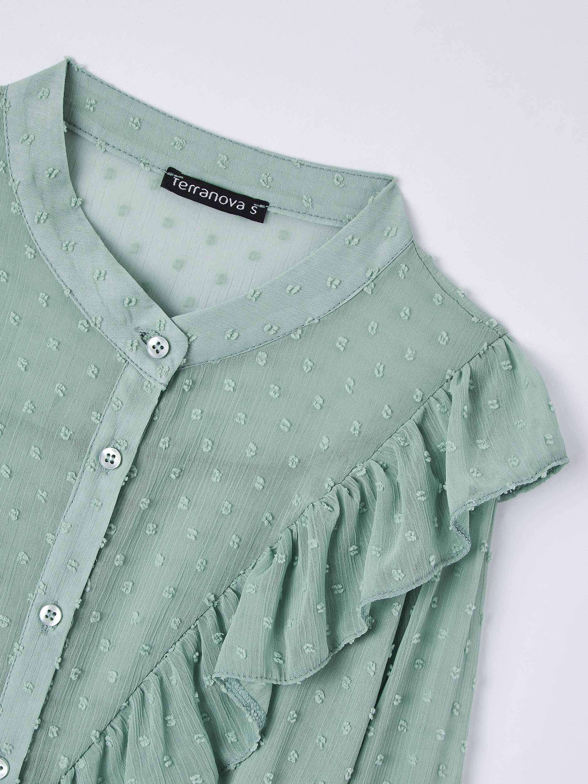 green ruffle shirt